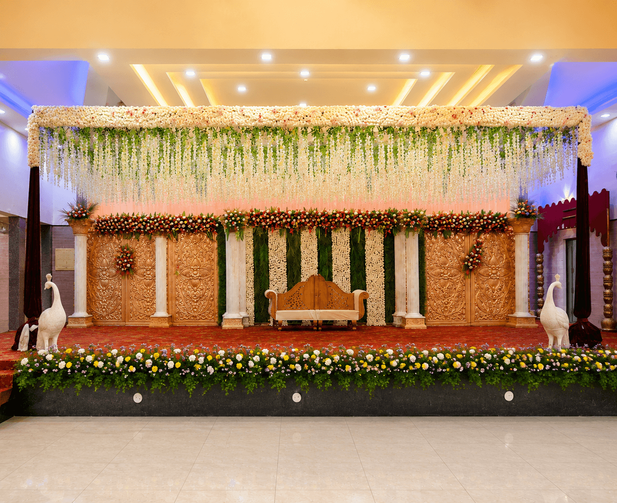 Marriage reception stage decoration in Bangalore with elegant floral backdrop
